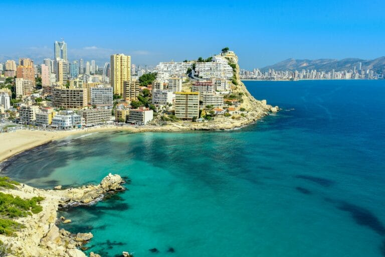 A stunning aerial view of Benidorm's coastline with skyscrapers and blue sea.